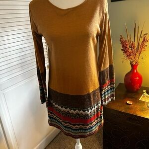 Yak & Yeti sweater tunic is gold.